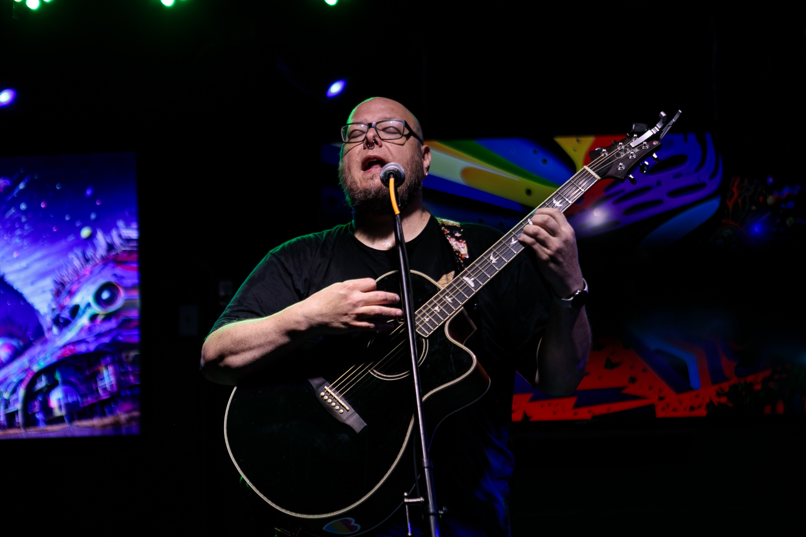 Anthony Gaff performing on a lit stage